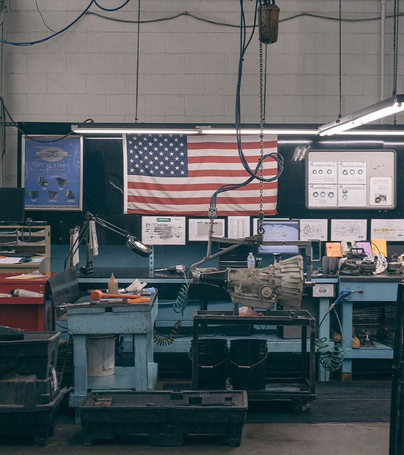American flag at work bench in Dynamic Manufacturing warehouse